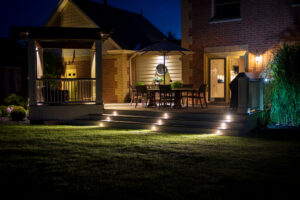 Residential home with security floodlights and landscape lighting