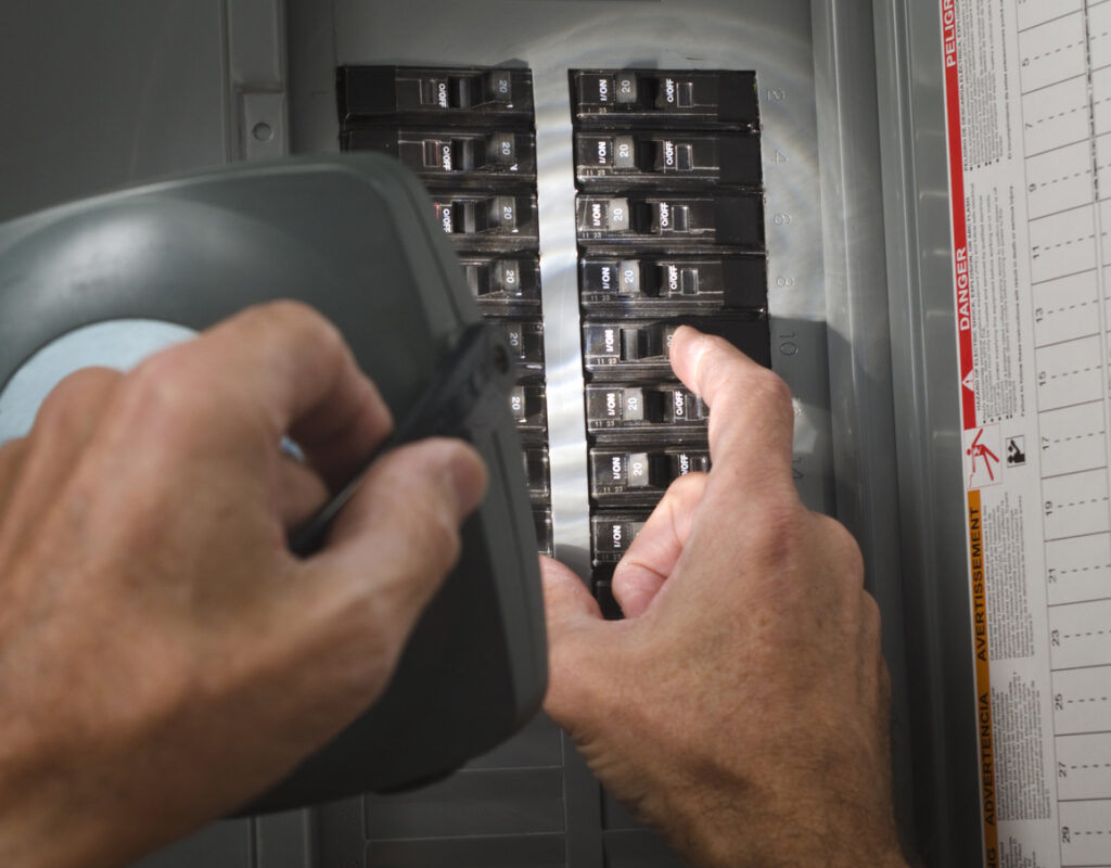 Homeowner flipping circuit breaker